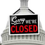Capital building with a sign saying "Sorry we're closed"
